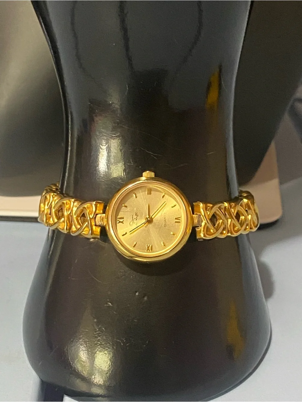 Decan De La Renta gold tone designer watch